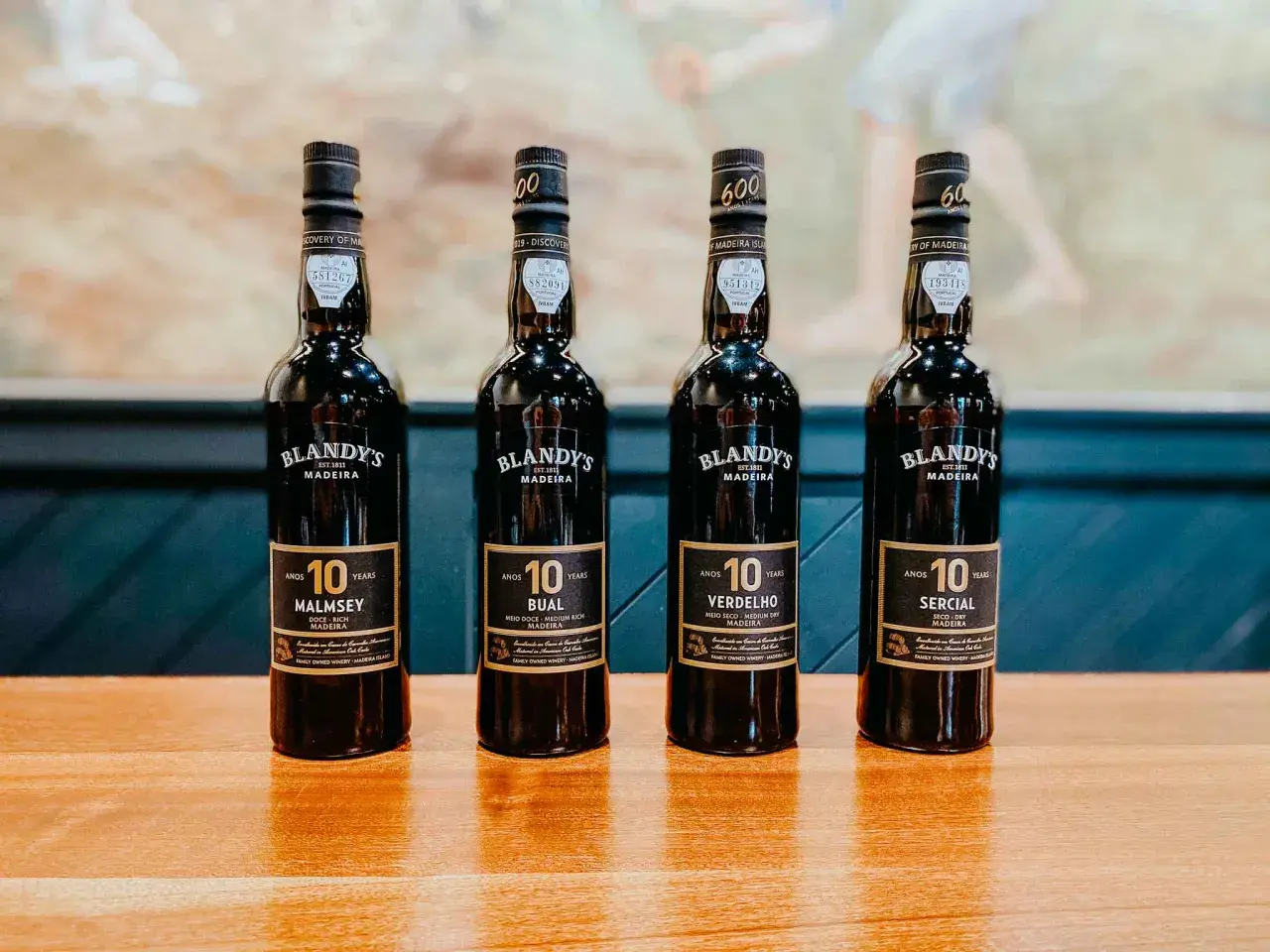 Cztery butelki wina madera Blandy's 10 Years: Malmsey, Bual, Verdelho i Sercial.